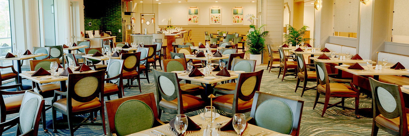 A dining room with tables and chairs. A dining room with tables and chairs.