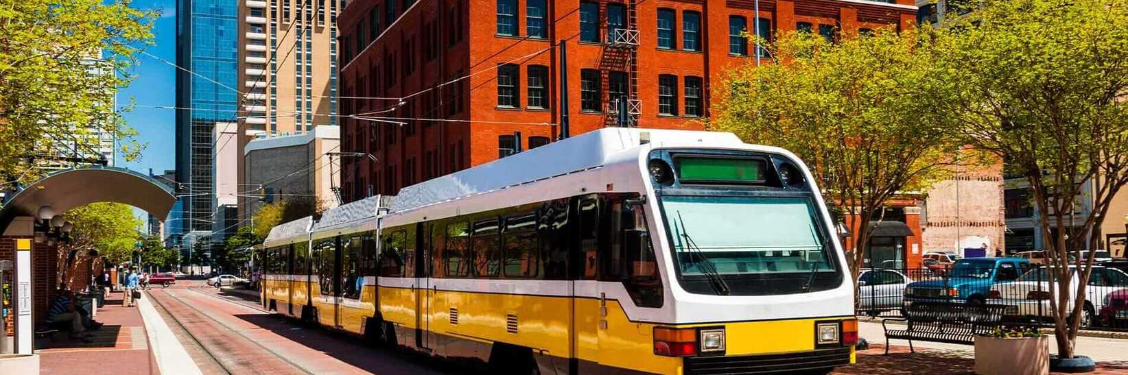 Wide angle view of a DART light rail train at a station in downtown. Wide angle view of a DART light rail train at a station in downtown.