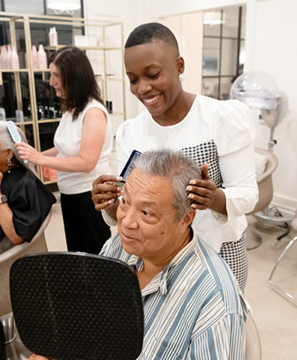 A person getting their hair done.