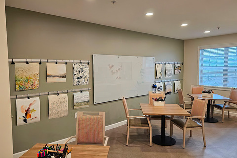 An art room with paintings on the wall.