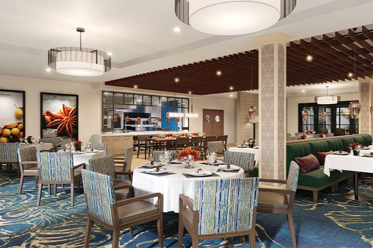 A dining room with tables set for dinner.