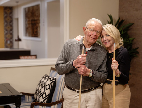 Two people playing pool.