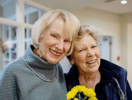Two people smiling together.