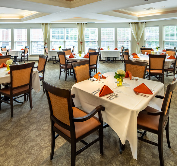 A dining room set for dinner.