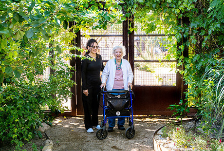 A resident with their caregiver at The Hacienda at The River senior living community in Tucson.