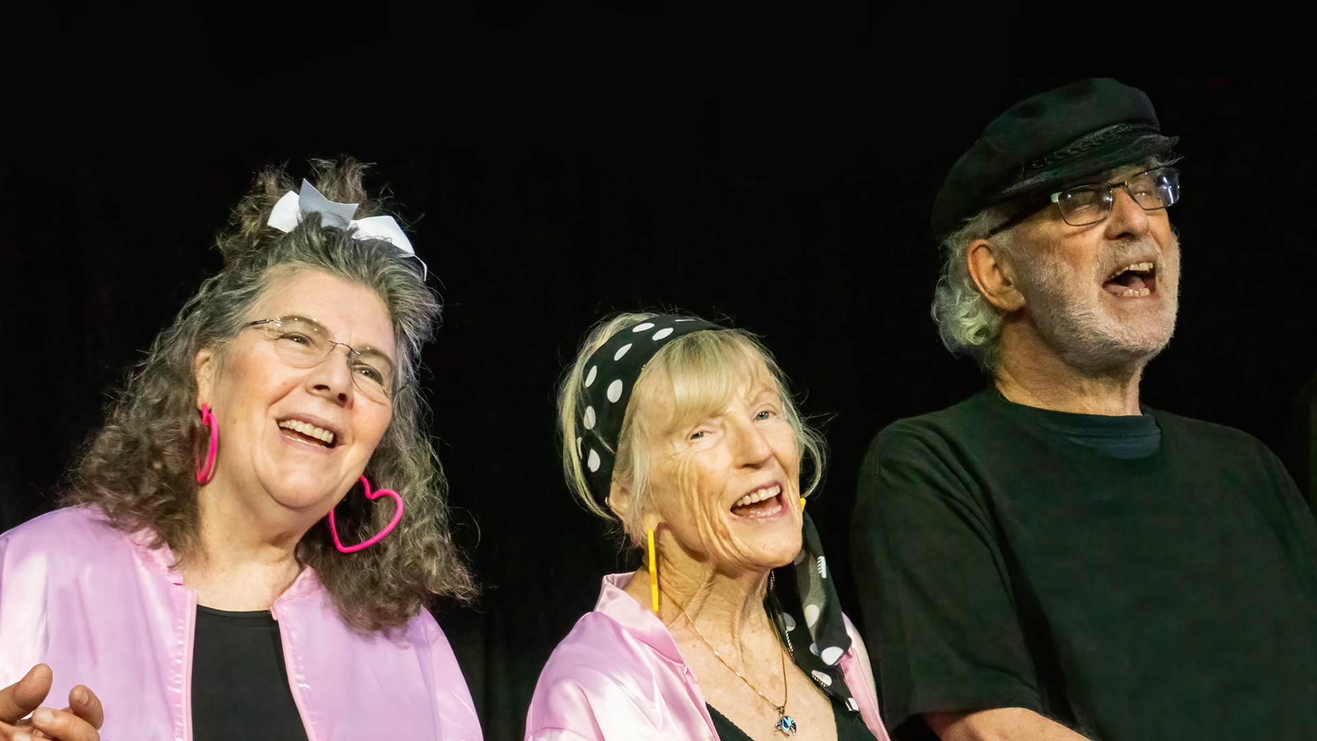 People singing on stage.