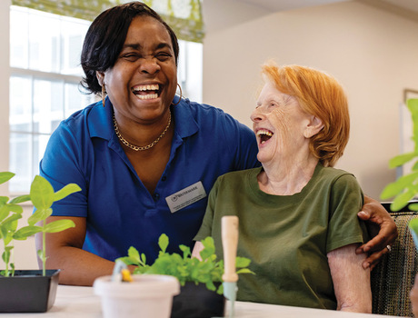 Two people laughing.