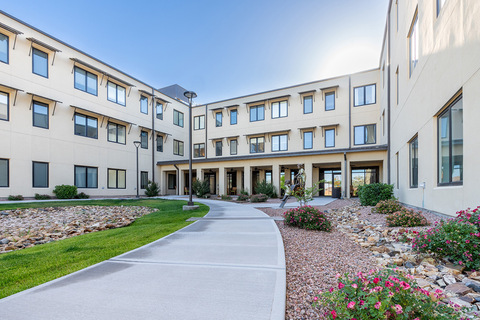 Exterior walking path in front of The Watermark at Cherry Hills, a senior living community in Albuquerque, NM.