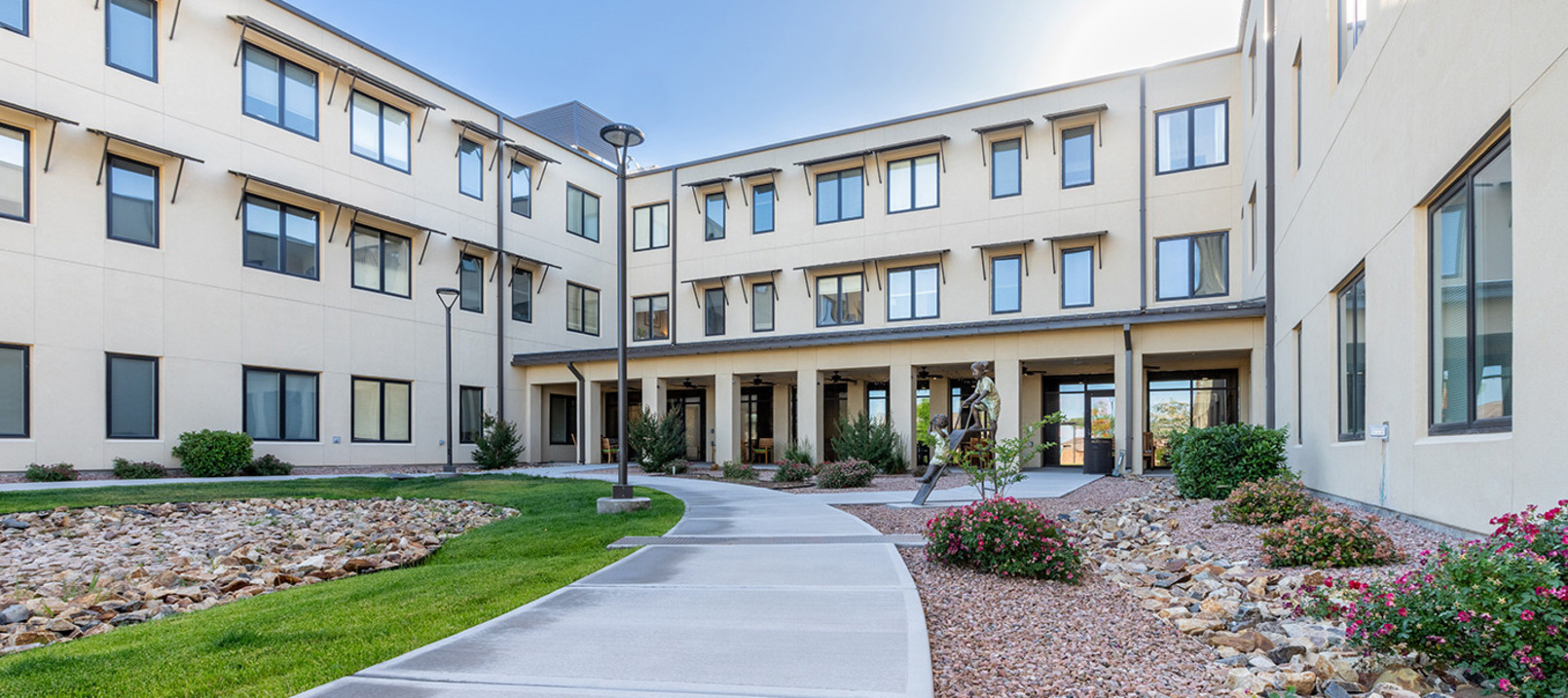 Exterior walking path in front of The Watermark at Cherry Hills, a senior living community in Albuquerque, NM. Exterior walking path in front of The Watermark at Cherry Hills, a senior living community in Albuquerque, NM.