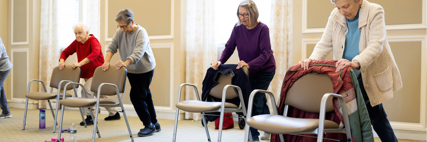 People stretching in a fitness class. People stretching in a fitness class.