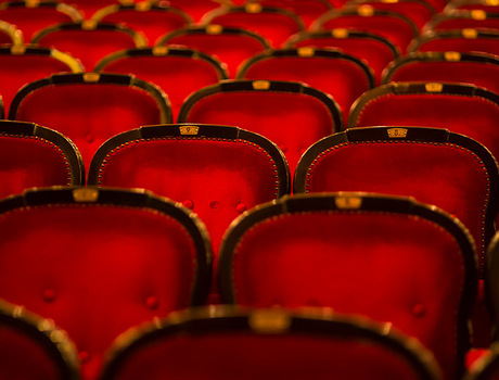 Red seats in movie theater.