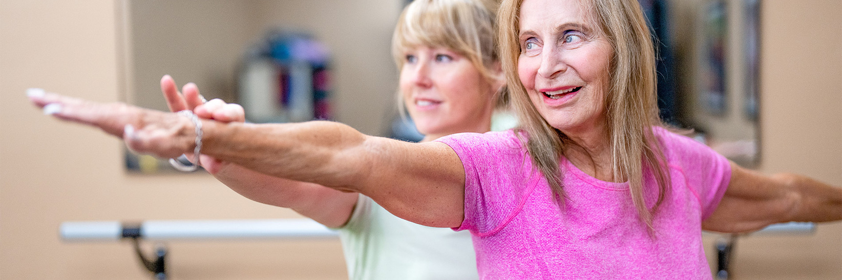 A person helping another with physical therapy. A person helping another with physical therapy.