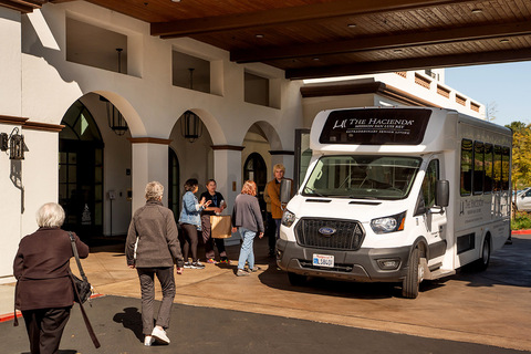 People loading into a bus.