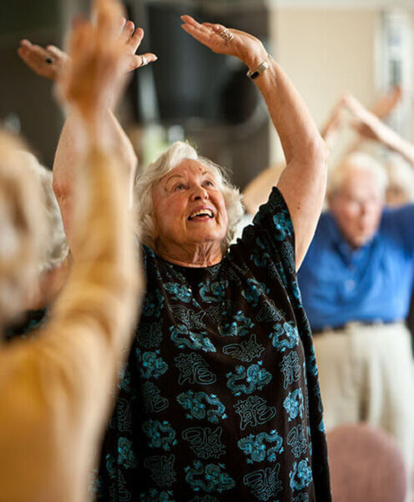 A resident is participating in a tai chi class. A resident is participating in a tai chi class.