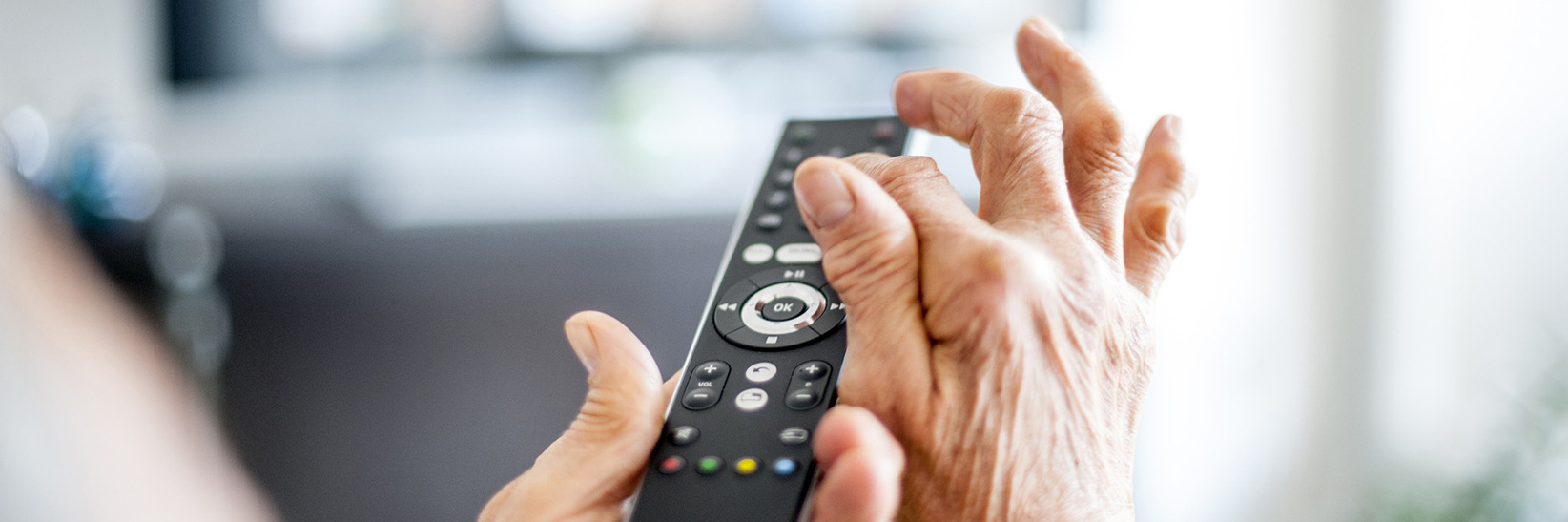 A person is using a remote. A person is using a remote.