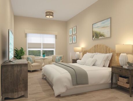 Studio apartment with a window, bed, dresser and side table.