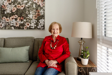 A person sitting on the couch at Watermark Laguna Niguel assisted living community.