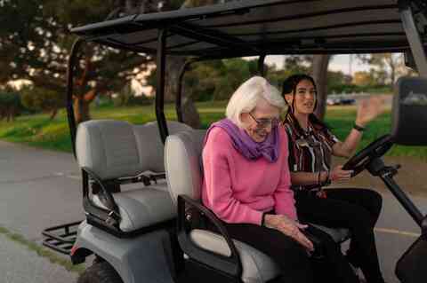 Resident on golf cart