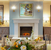 Fireplace by seating area.