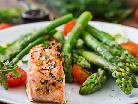 Salmon with asparagus on a plate.