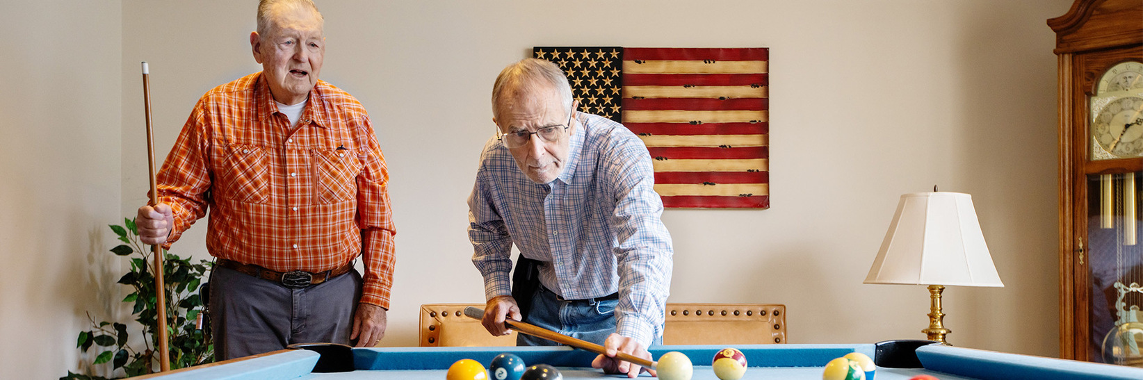 Two people playing pool. Two people playing pool.