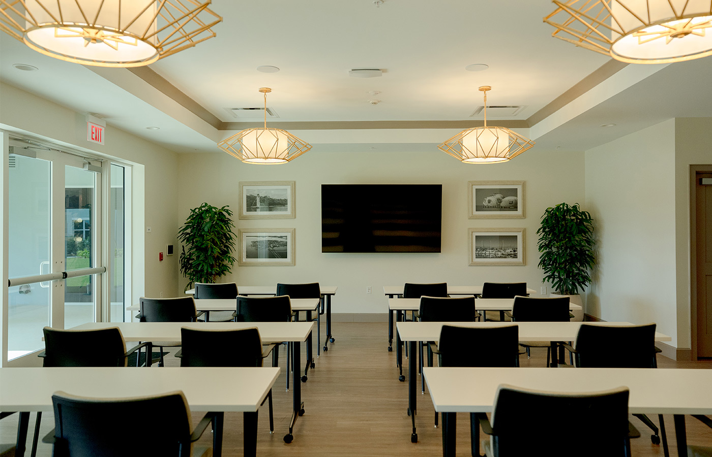 A classroom with tables and chairs.