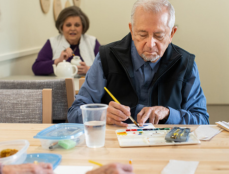 Residents in a painting class.
