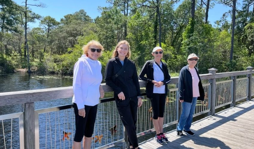 Residents in a walking club on a nature trail.