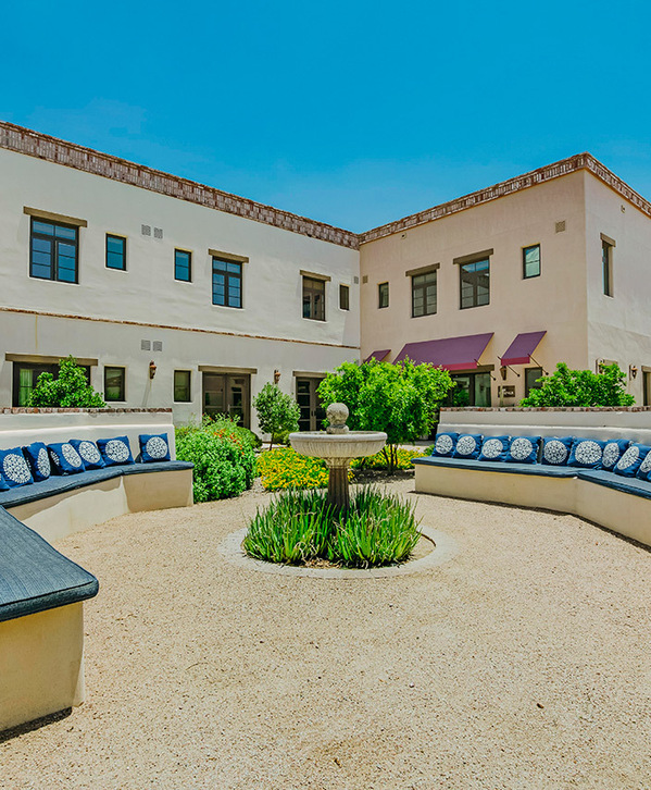 Accordion image The Hacienda at the River exterior building and courtyard.
