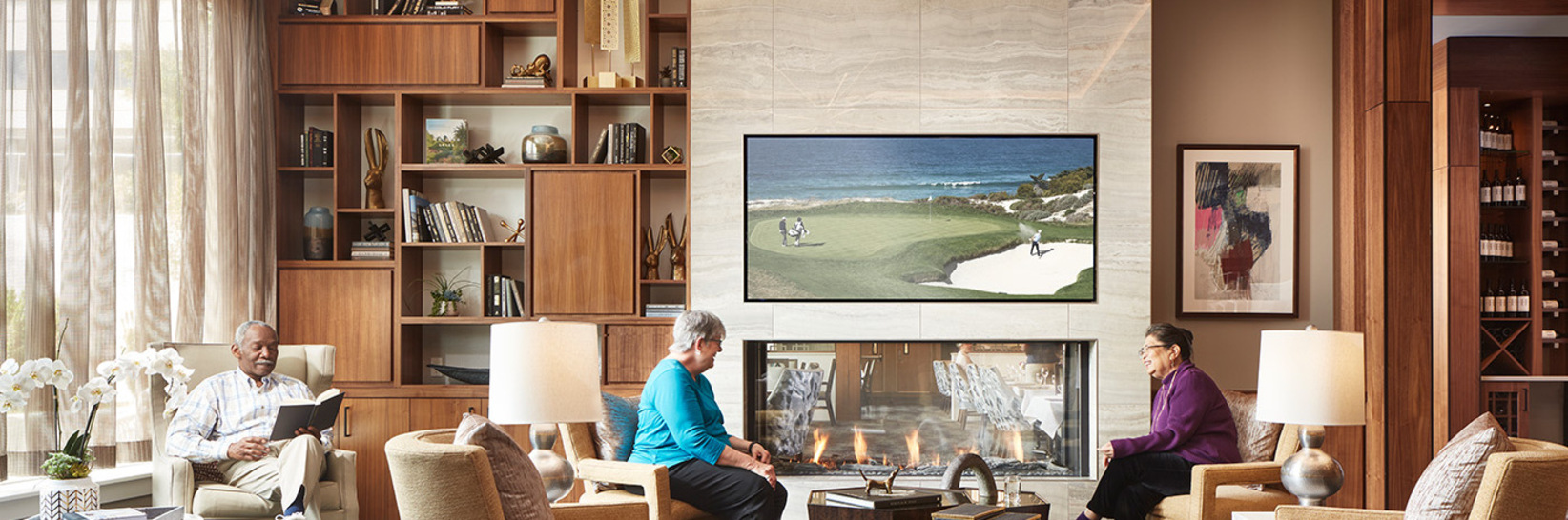 People enjoying a common living room area. People enjoying a common living room area.