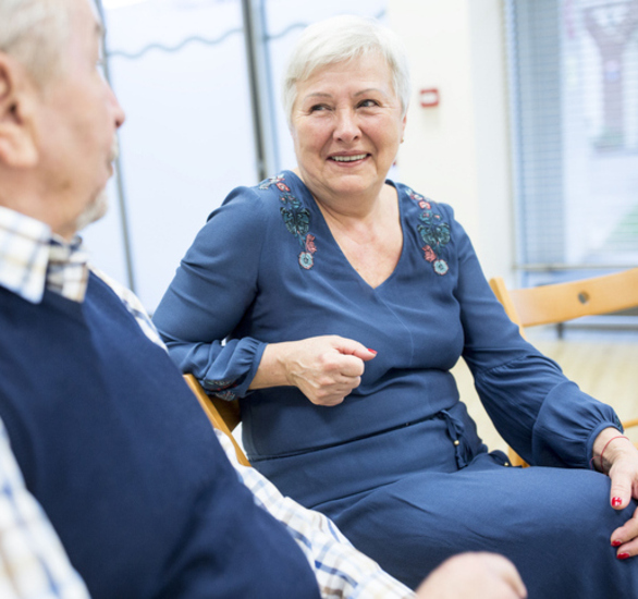 Two people talking in a support group. 