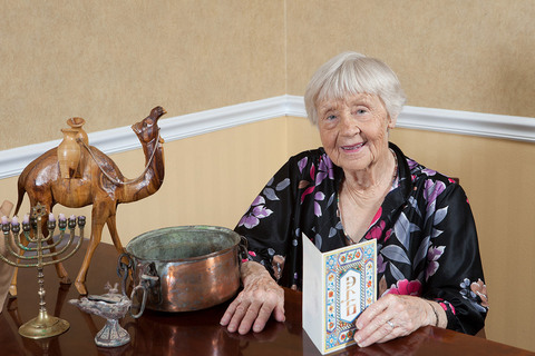 A resident is holding a card.