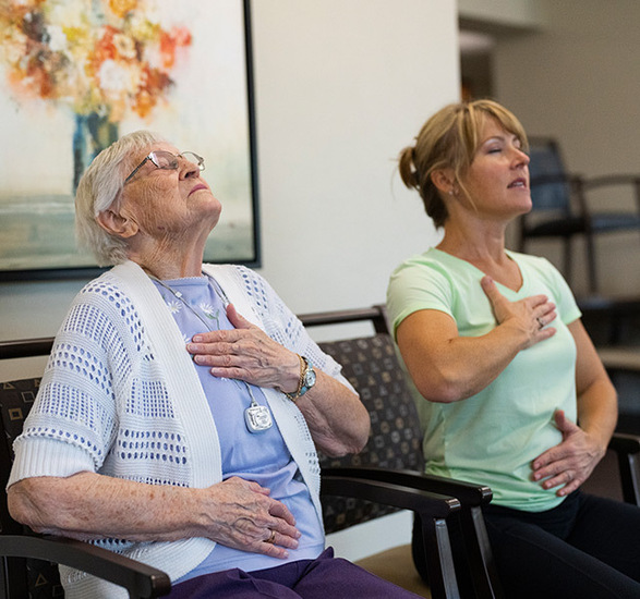 Residents practicing breathing exercises.