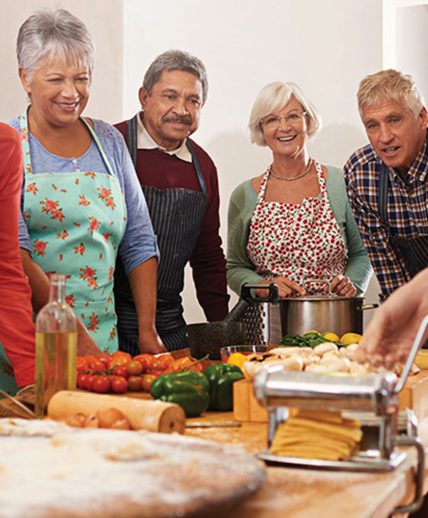 Accordion image A group of seniors in a cooking class.