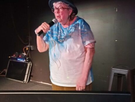 Resident singing karaoke.
