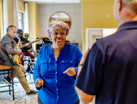 A live band playing music while residents dance.