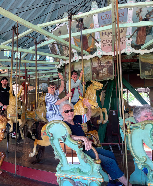 A group of people on a merry-go-round.