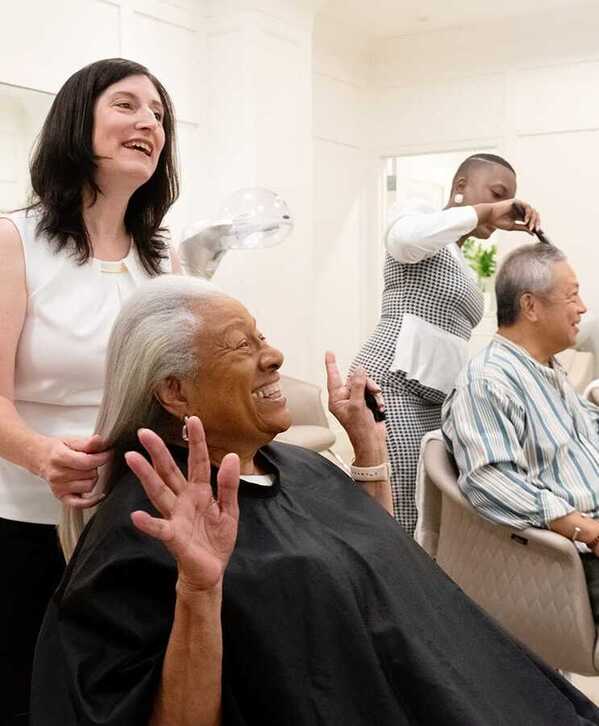Indulge A resident is having their hair styled at a salon.