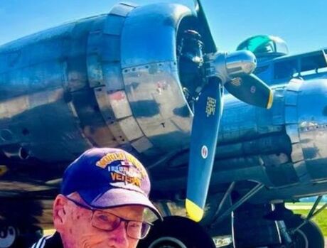 Resident in front of plane