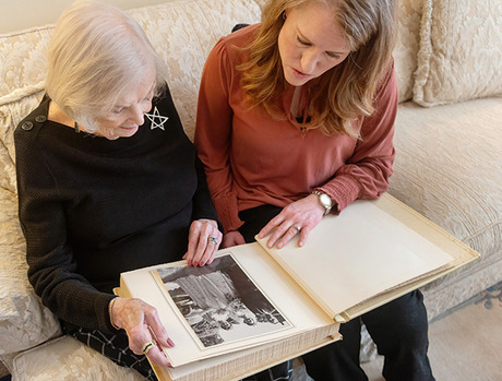 A resident showing someone their photo album.