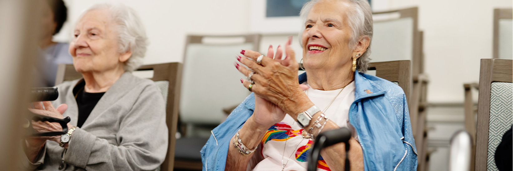 People clapping and smiling. People clapping and smiling.