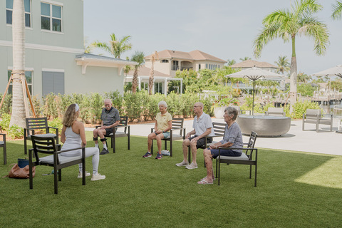 People working out on the lawn.