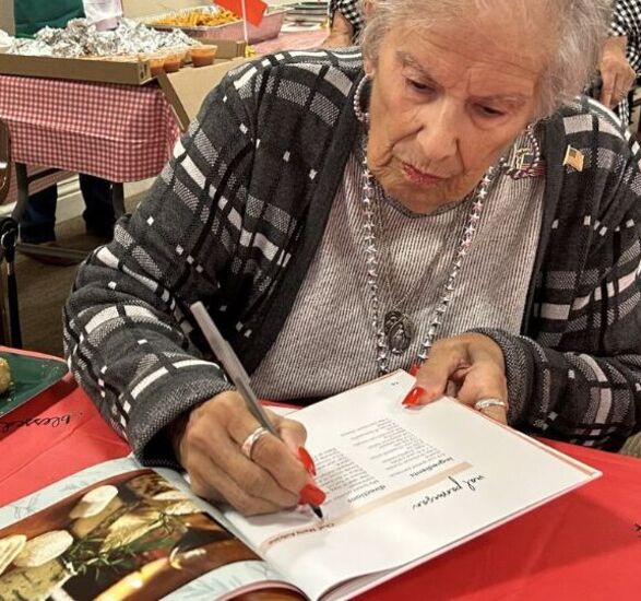 Resident signing cookbook.