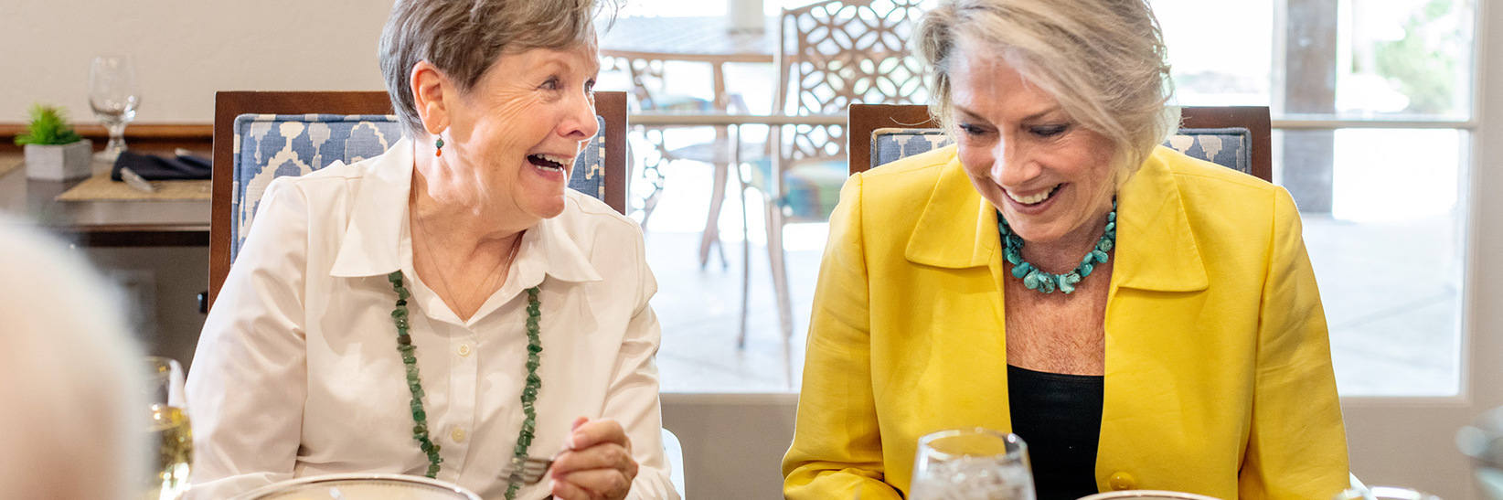 Two residents are having a meal together. Two residents are having a meal together.