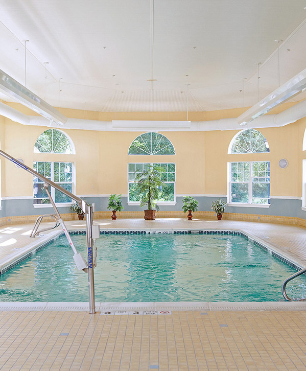 Accordion image Indoor pool with seating area.