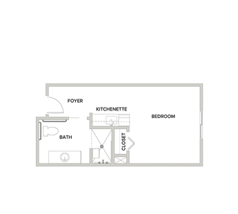 An assisted living studio suite floor plan with an open living/bedroom space and kitchenette.