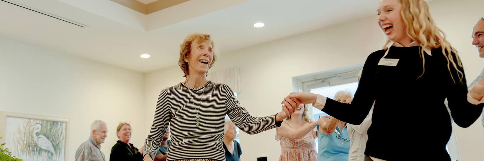 People dancing at The Watermark at Marco Island, a Memory Care Community.