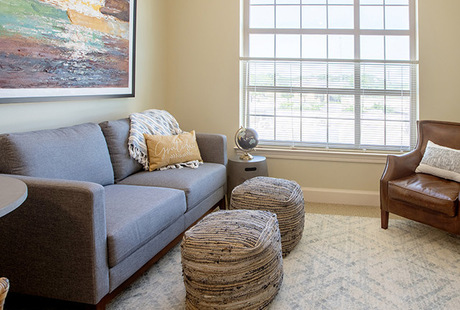 A fully furnished model living room at The Watermark at Southpark Meadows, a senior living community in Austin.