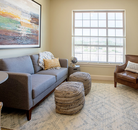 A fully furnished model living room at The Watermark at Southpark Meadows, a senior living community in Austin.