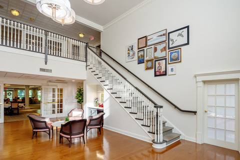 A bright lobby area with a staircase.